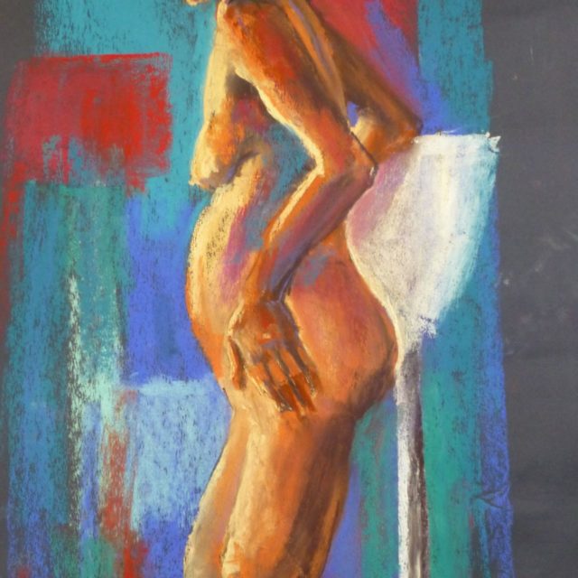 Julie Standing - A female life model standing amid an asymmetric coloured background - Pastel Painting