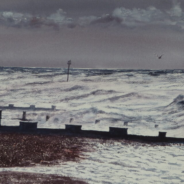 A watercolour painting of Bexhill Beach with stormy, winter waves breaking out onto the shingle beach and against the groynes