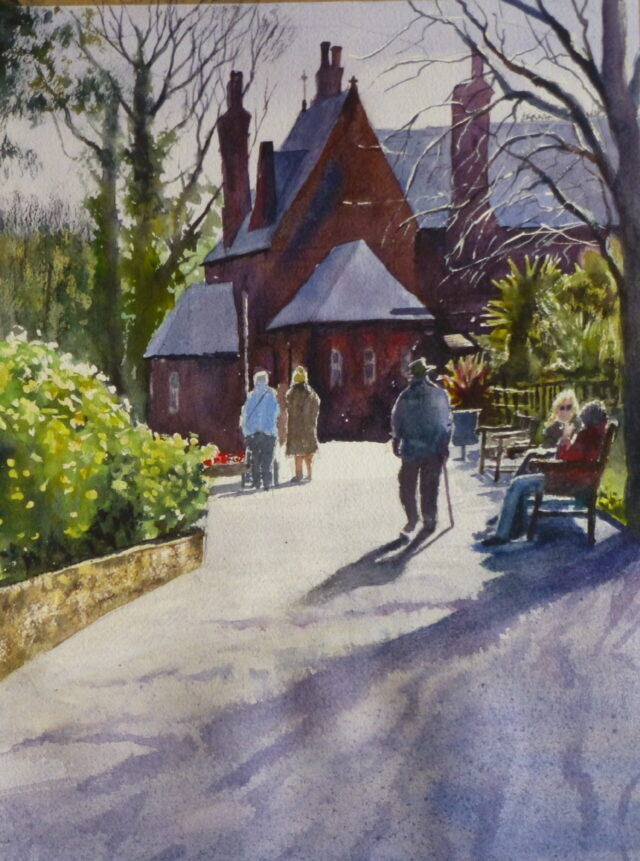 A watercolour painting of the Botanic Gardens in Southport in the spring sunshine close to the main gate with strollers and people sitting on the benches.