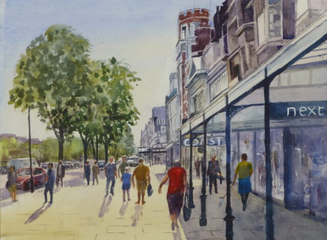 A watercolour painting of Lord Street Southport looking at the view of pedestrians on the Pavement near the Sacisbrick Hotel with the arcade putting the shops in the shade and the trees in full leaf.
