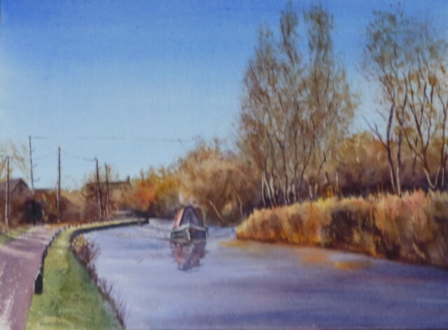 A watercolour painting of the Leeds Liverpool Canal at Downholland Cross with a narrowboat steaming towards the the viewer. It is a bright winter's day with blue sky, the reeds and birches illuminated in the sunlight.