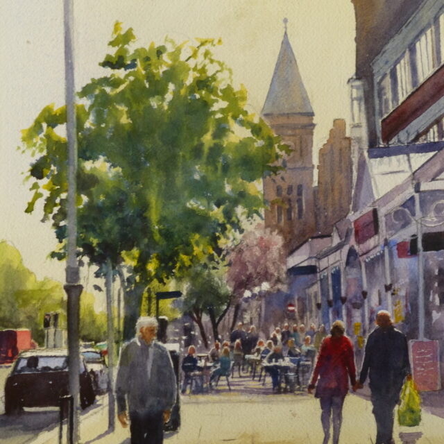 A watercolour painting of Lord Street in Southport on a busy summer's day with pedestrians and drinkers amid some of the iconic buildings.
