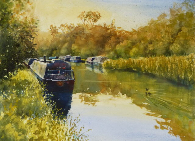 A watercolour painting of the Leeds/Liverpool Canal at Parbold with a narrowboat moored amongst the sunlit grasses of the bank.
