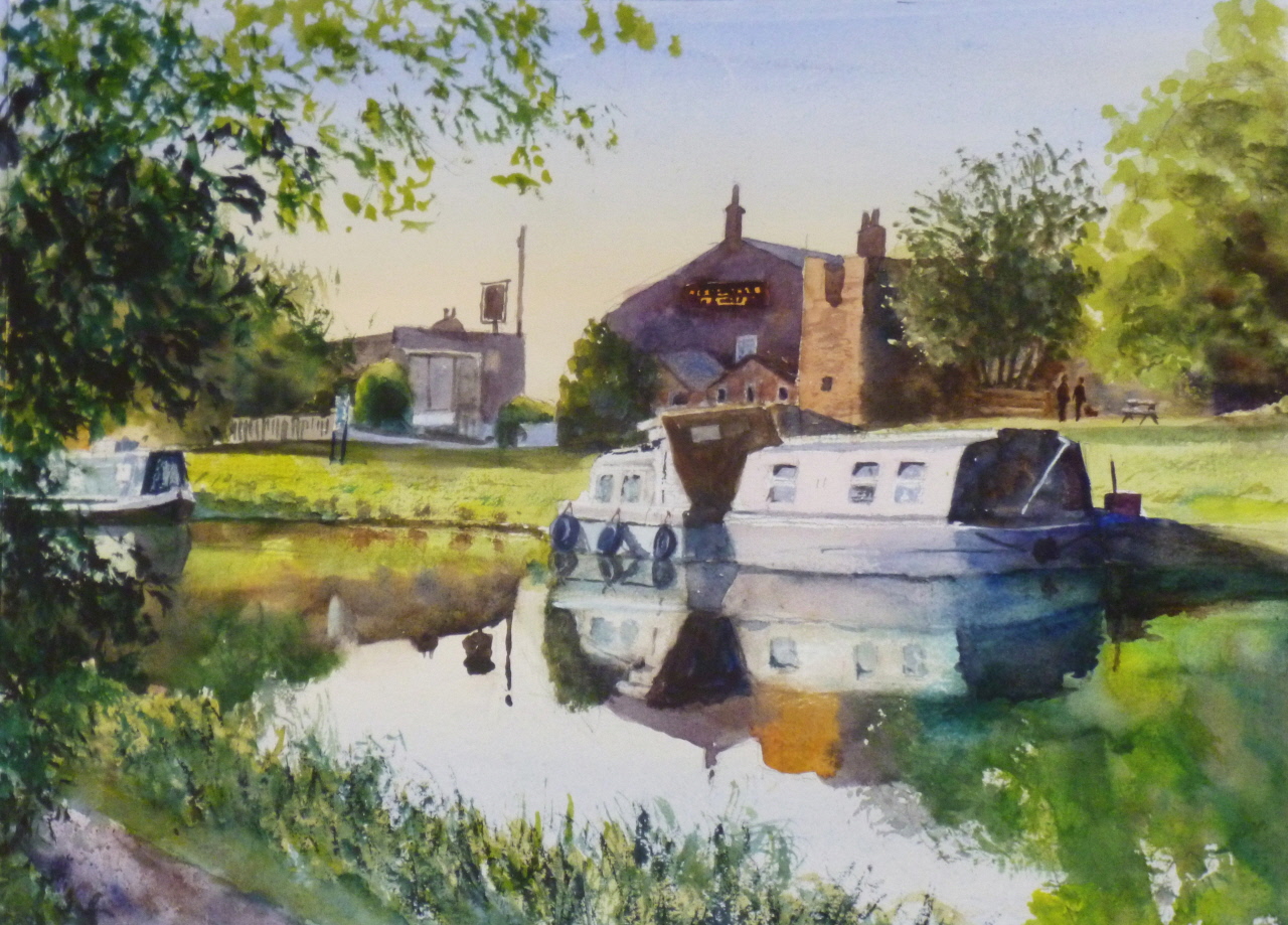 A view of the Leeds to Liverpool Canal and moored narrowboats at the Heatons Bridge Inn